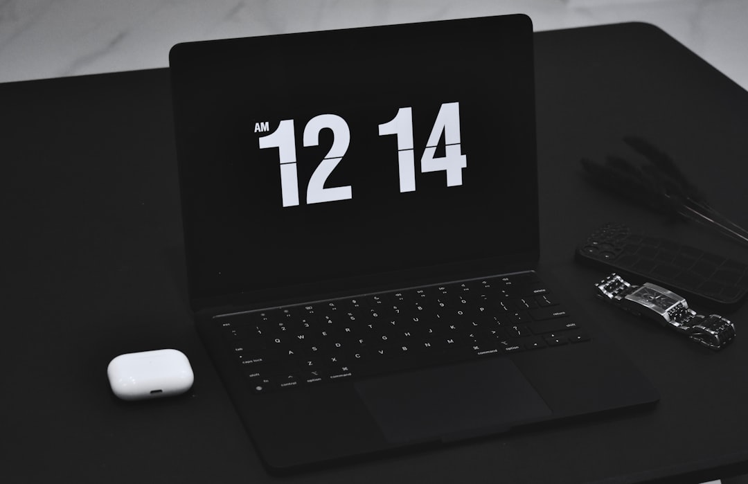 A clean, modern desk setup with a laptop, calculator, and notebook, symbolizing a small business owner carefully planning their SEO budget and investment.