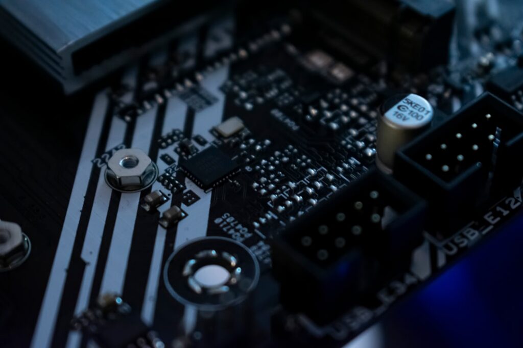 Close-up of a modern circuit board with glowing blue lines representing the flow of data through an AI supply chain.