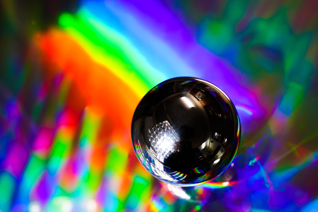 A bright, clean photo of a glass prism refracting a beam of light into a rainbow, symbolizing the process of quantifying revenue and bringing clarity to complex data.