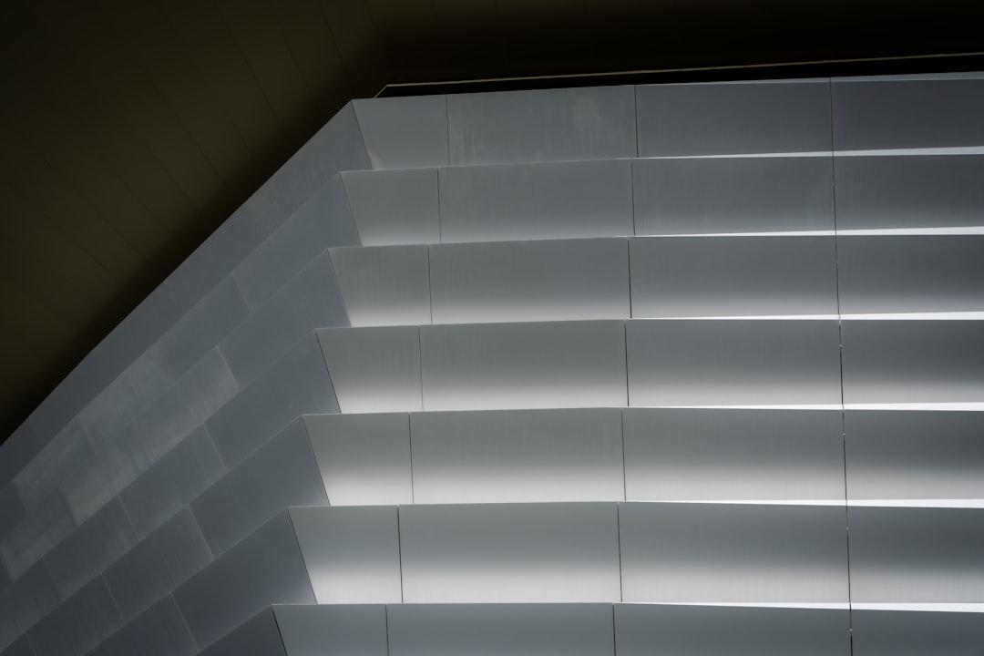A clean, minimalist close-up of architectural lines on a modern building, illustrating the concept of a strong and well-designed revenue infrastructure.