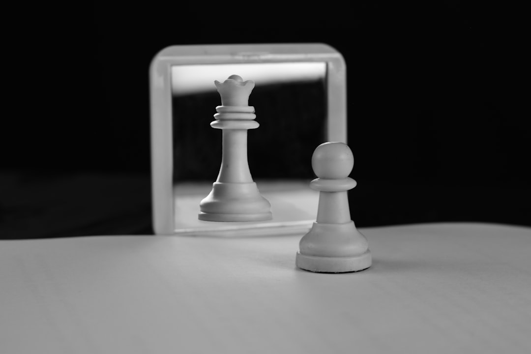A single chess piece, illuminated by a dramatic spotlight on a chessboard, representing strategic precision in a complex environment.