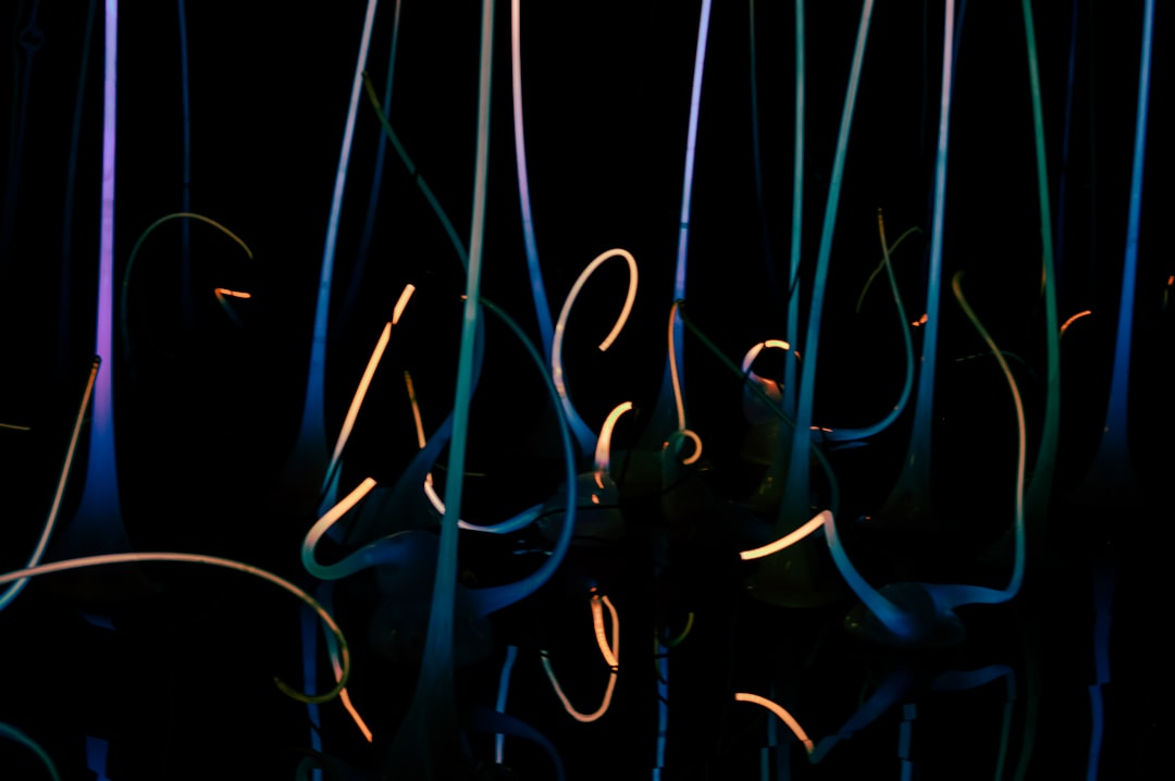 An abstract, close-up view of glowing blue fiber optic cables, representing the flow of data as the infrastructure for future AI answers.