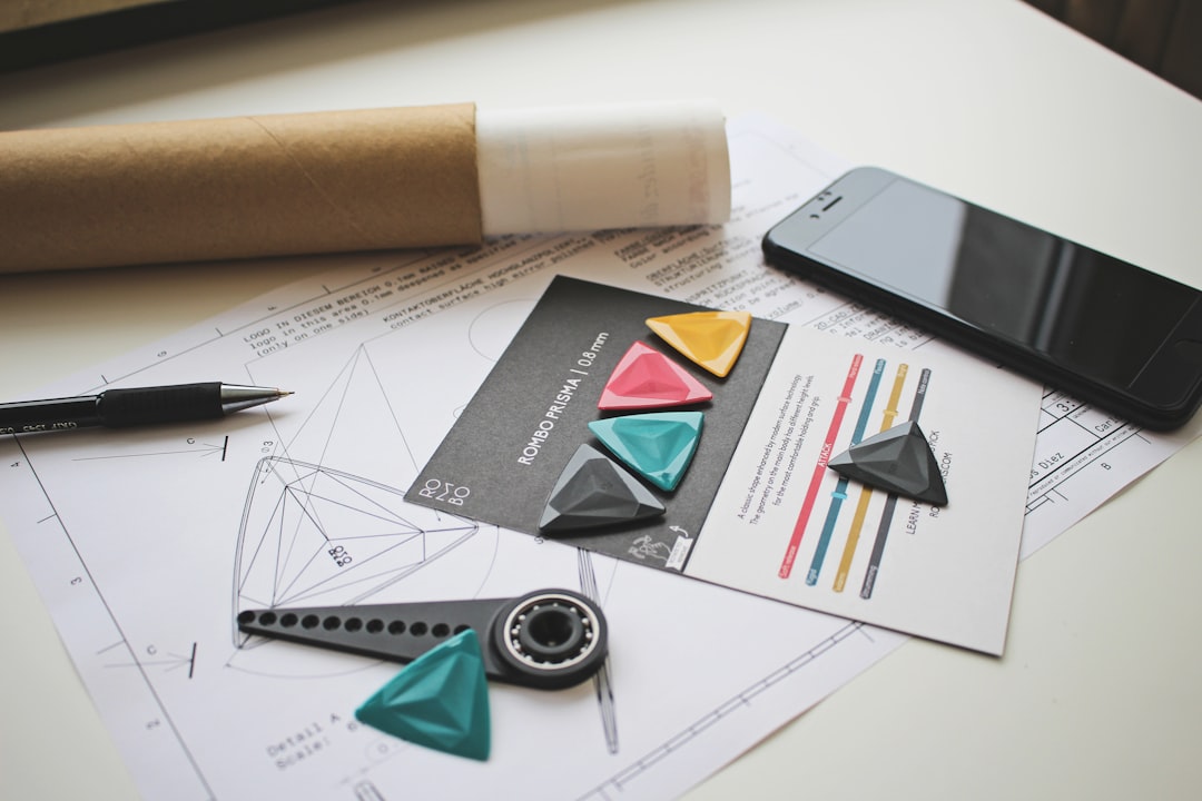 Architectural blueprints and tools laid out on a bright, modern desk, symbolizing the precision of a version-controlled semantic model.