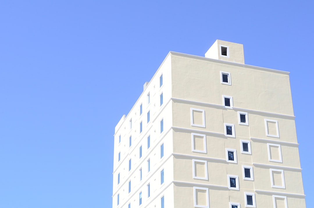 A clean, minimalist photo of a white architectural model of a modern building, representing a well-planned and engineered business asset.