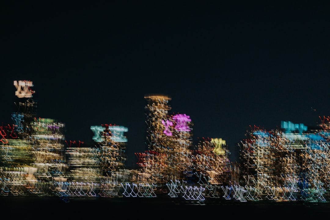 A modern cityscape photograph distorted with digital glitch artifacts, symbolizing the data compression issues that harm SEO performance.