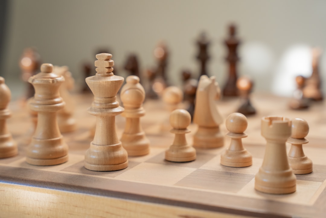 A single, polished chess piece being moved on a minimalist board, symbolizing the strategic thinking required for a CTO to win the AI provenance war.