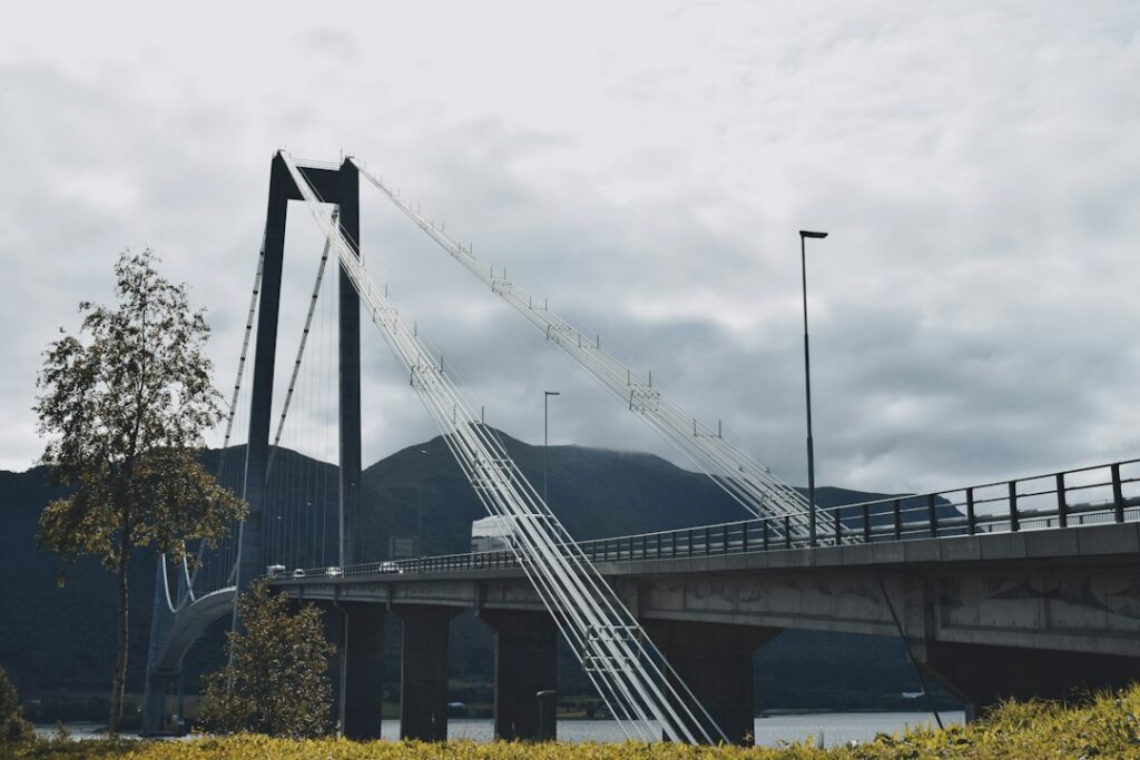 Dramatic view of a broken suspension bridge hanging over a deep canyon, symbolizing the attribution gap in marketing techn...