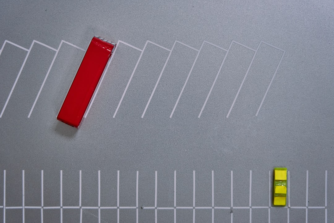 A line of dominoes captured mid-fall in a chain reaction against a clean background, visually representing the cascading consequences of an initial small error.