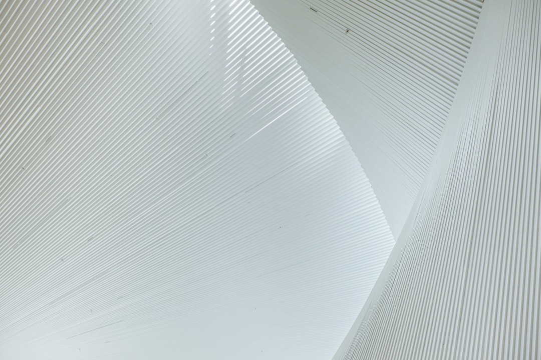 A modern architectural bridge with clean lines against a bright sky, symbolizing the connection between SEO infrastructure and verifiable financial outcomes.