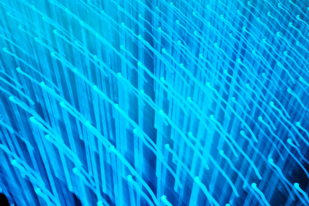 Abstract blue light trails flowing in an organized network on a dark background, illustrating the concept of clean, structured data flow for AI.
