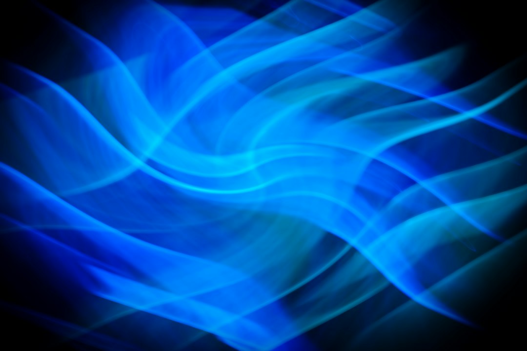An abstract technology background with glowing blue lines forming an interconnected network, representing a structured and predictable data-driven model.