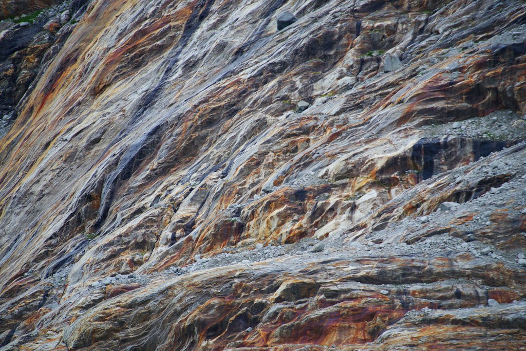 Detailed cross-section of geological rock strata, with distinct layers of color and texture, symbolizing an immutable and auditable history of events.